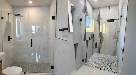 Frameless sliding glass patio doors with matte black hardware installed on residential home exterior — Glass Designer LLC Fort Myers FL