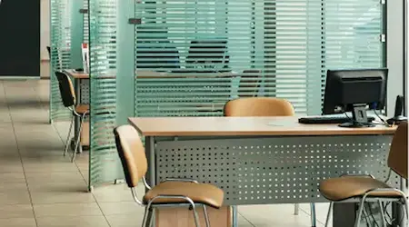 Commercial frameless glass storefront doors and entrance enclosure installed by Glass Designer LLC in Southwest Florida